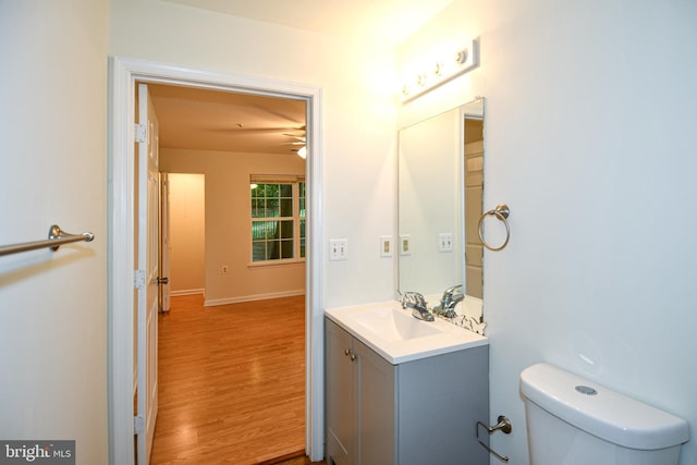 1031 Gardenview Loop Unit 103, Woodbridge, VA 22191 - half bathroom featuring vanity, wood finished floors, and ceiling fan