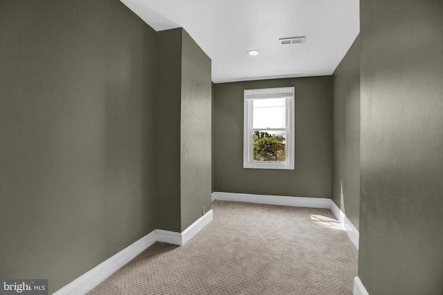 503 W 27th St, Baltimore, MD 21211 - spare room with carpet and baseboards