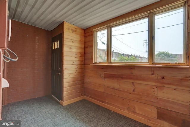 503 W 27th St, Baltimore, MD 21211 - empty room featuring carpet and wood walls