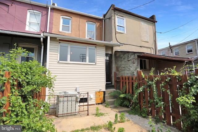 503 W 27th St, Baltimore, MD 21211 - rear view of house featuring central AC unit and stucco siding