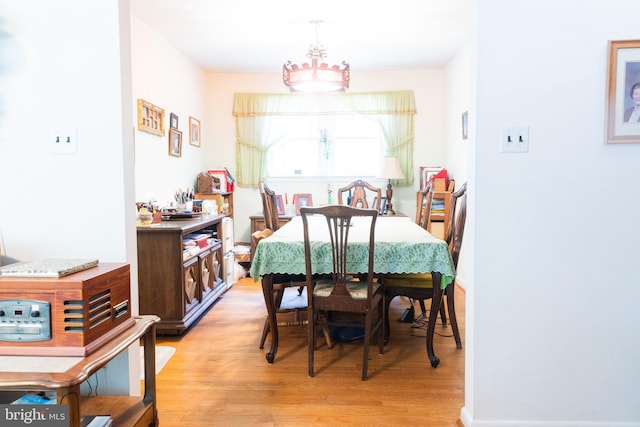 2720 Hidden Valley Rd, Accokeek, MD 20607 - dining space with light wood-style floors and a chandelier