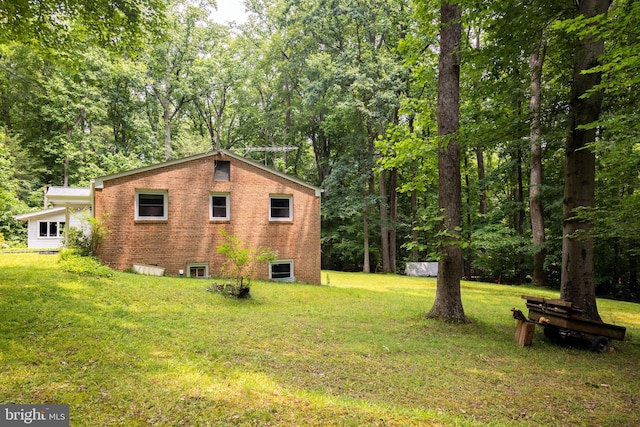 2720 Hidden Valley Rd, Accokeek, MD 20607 - view of side of property with brick siding and a lawn