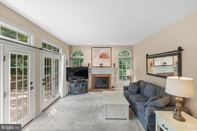 1381 Sunwood Ter, Annapolis, MD 21409 - carpeted living area with plenty of natural light and a brick fireplace