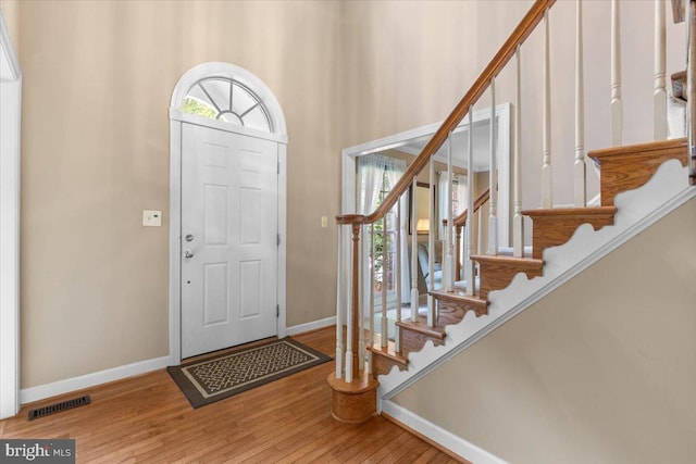 1381 Sunwood Ter, Annapolis, MD 21409 - entrance foyer with baseboards, wood finished floors, and stairs
