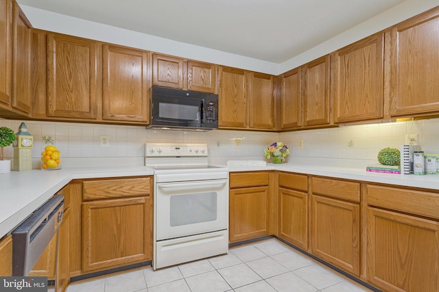 2615 Rigging Dr Unit 2615, Annapolis, MD 21401 - kitchen featuring white electric stove, black microwave, dishwashing machine, and light countertops
