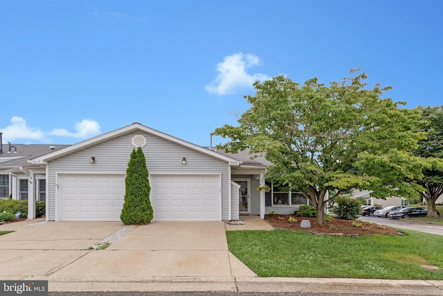 2615 Rigging Dr Unit 2615, Annapolis, MD 21401 - view of front of property with concrete driveway, a garage, and a front yard