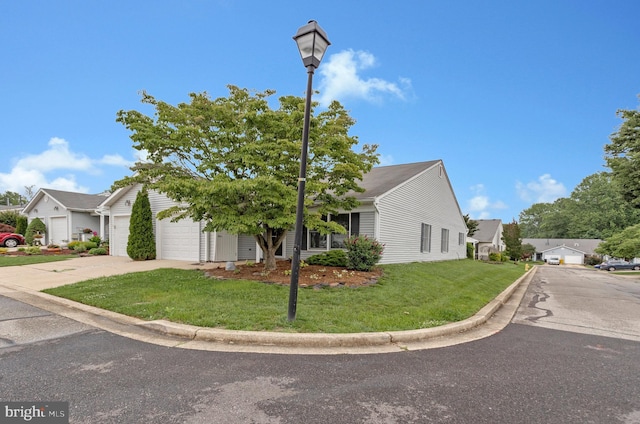 2615 Rigging Dr Unit 2615, Annapolis, MD 21401 - view of front of home with concrete driveway, an attached garage, and a front lawn