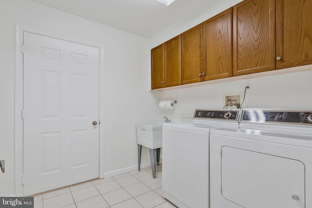 2615 Rigging Dr Unit 2615, Annapolis, MD 21401 - washroom featuring washer and dryer, cabinet space, and light tile patterned floors