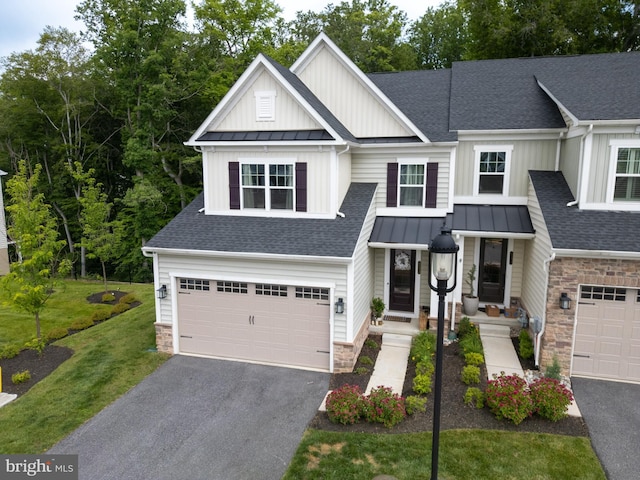 233 W Ponds Edge Dr, Media, PA 19063 - view of front of home featuring a standing seam roof, stone siding, and driveway
