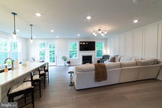 233 W Ponds Edge Dr, Media, PA 19063 - living area featuring wood finished floors, a decorative wall, recessed lighting, a fireplace, and baseboards