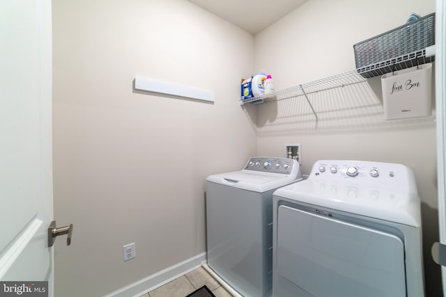 233 W Ponds Edge Dr, Media, PA 19063 - laundry room featuring independent washer and dryer, tile patterned floors, and baseboards