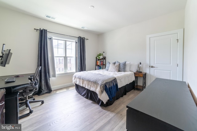 233 W Ponds Edge Dr, Media, PA 19063 - bedroom with light wood-style floors, an office area, and baseboards