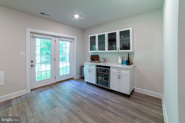 233 W Ponds Edge Dr, Media, PA 19063 - indoor dry bar featuring wine cooler, dark wood-style floors, and baseboards