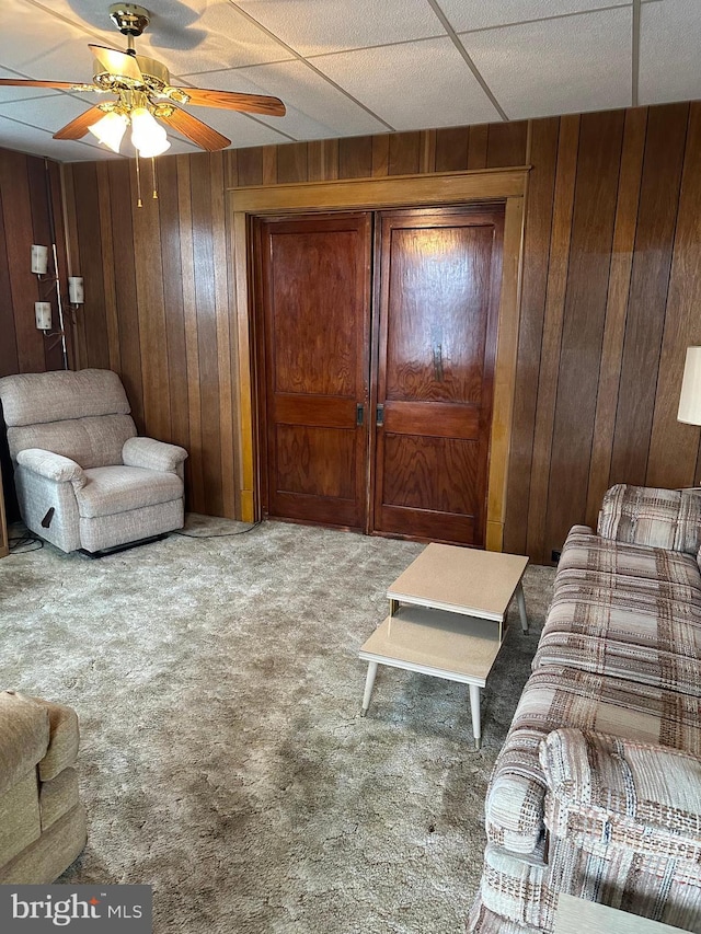 409 S Balliet St, Frackville, PA 17931 - carpeted living room with wood walls and ceiling fan