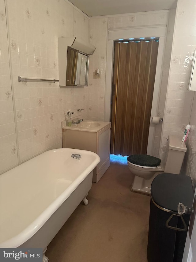 409 S Balliet St, Frackville, PA 17931 - full bathroom with a freestanding bath, tile walls, toilet, and vanity