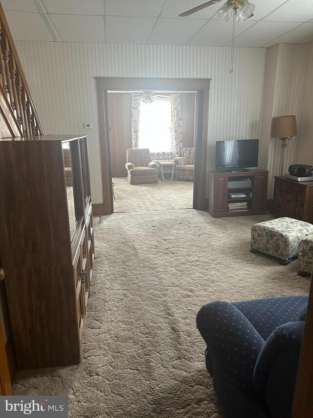 409 S Balliet St, Frackville, PA 17931 - living room featuring a paneled ceiling, carpet, and a ceiling fan