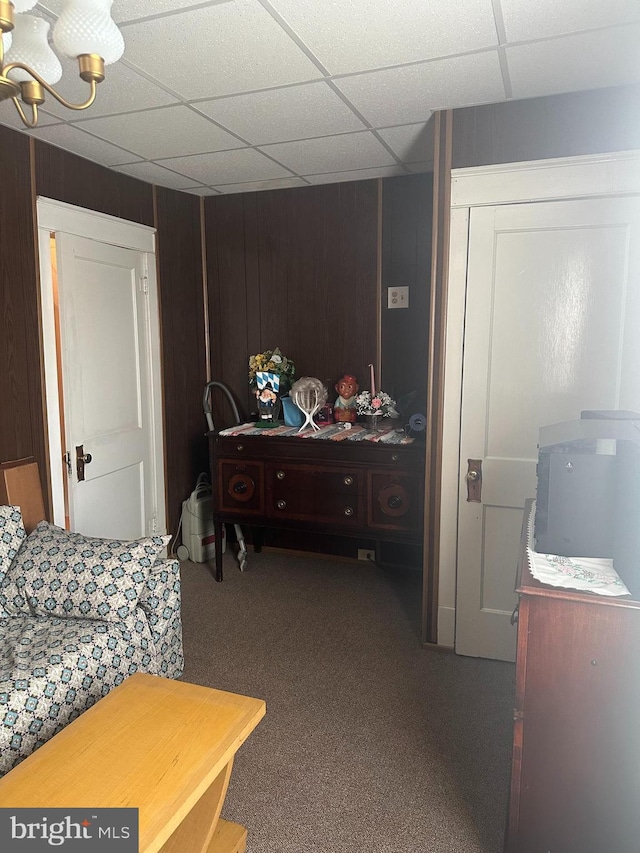 409 S Balliet St, Frackville, PA 17931 - bedroom featuring carpet, a chandelier, a paneled ceiling, and wood walls