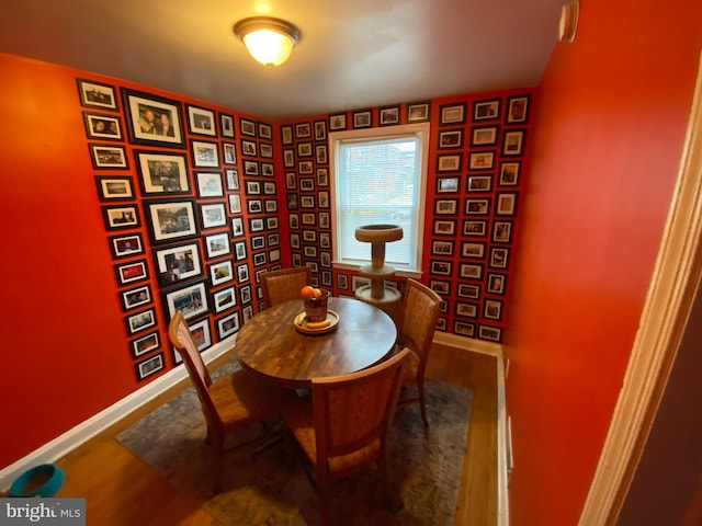 706 Yale Ave, Baltimore, MD 21229 - dining area with baseboards and wood finished floors