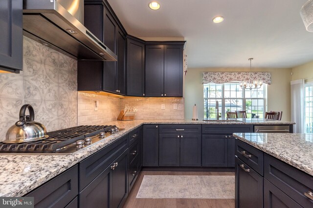 2038 Morgan Creek Dr, Quakertown, PA 18951 - kitchen with a sink, wall chimney exhaust hood, stainless steel appliances, a chandelier, and recessed lighting