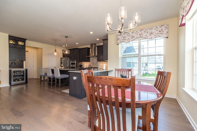 2038 Morgan Creek Dr, Quakertown, PA 18951 - dining room with beverage cooler, a chandelier, dark wood finished floors, recessed lighting, and baseboards