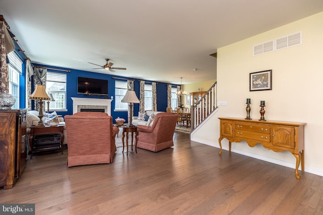 2038 Morgan Creek Dr, Quakertown, PA 18951 - living area with wood finished floors, a ceiling fan, stairs, and a fireplace