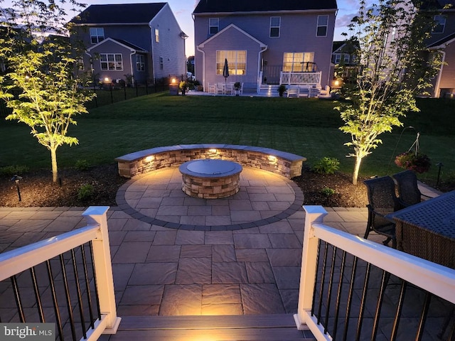 2038 Morgan Creek Dr, Quakertown, PA 18951 - patio terrace at dusk with a fire pit and a patio area