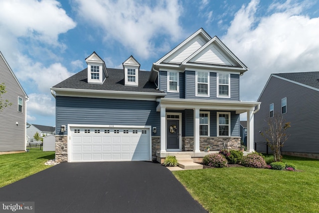 2038 Morgan Creek Dr, Quakertown, PA 18951 - view of front facade featuring stone siding, asphalt driveway, a front yard, covered porch, and a shingled roof