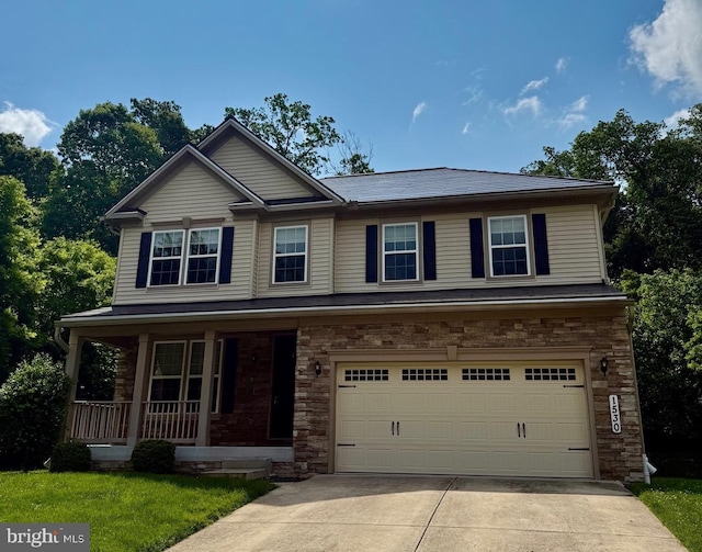 1530 Swearingen Dr, Bel Air, MD 21014 - view of front facade with covered porch, concrete driveway, a garage, and stone siding