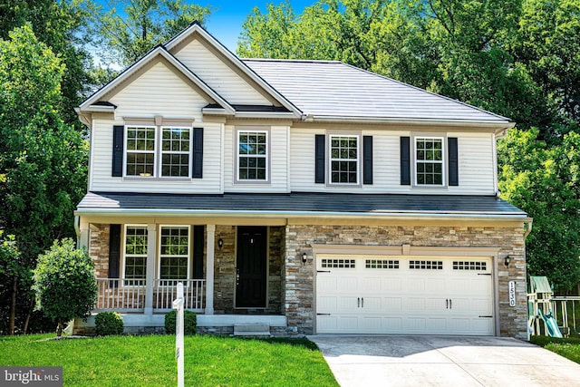1530 Swearingen Dr, Bel Air, MD 21014 - view of front facade featuring concrete driveway, a garage, covered porch, and a front lawn