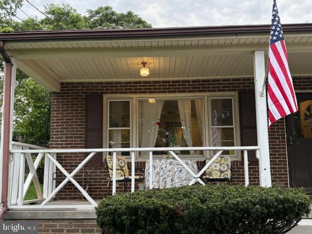 425 Beechcroft Rd, Winchester, VA 22601 - view of exterior entry with brick siding and covered porch