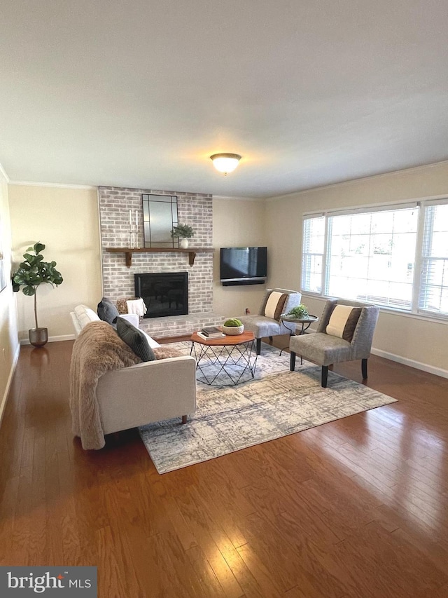 4212 Penner Ln, Fairfax, VA 22033 - living area featuring hardwood / wood-style floors, baseboards, and a brick fireplace