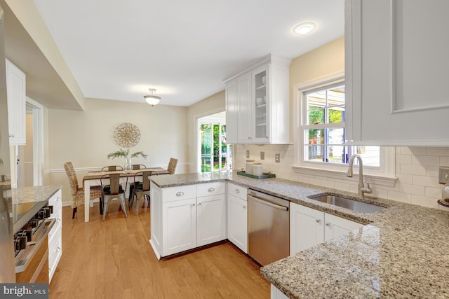 4212 Penner Ln, Fairfax, VA 22033 - kitchen with dishwasher, a sink, light wood-style floors, white cabinetry, and a peninsula