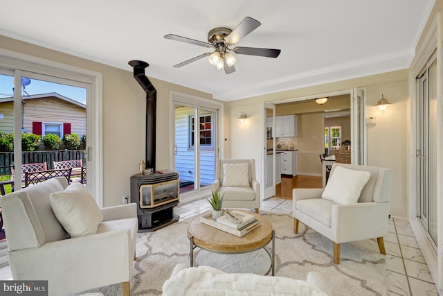 4212 Penner Ln, Fairfax, VA 22033 - living room with a wood stove, a ceiling fan, and baseboards