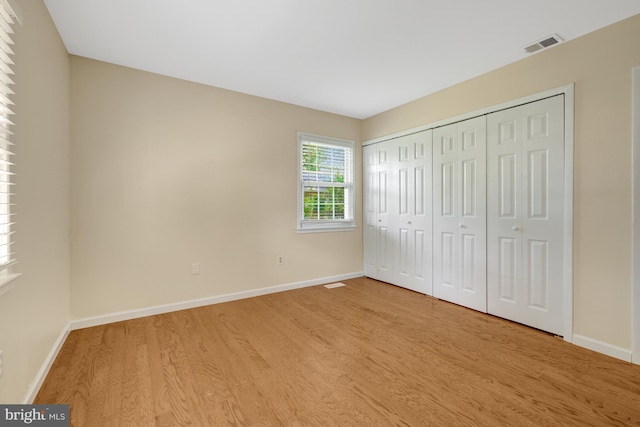 4212 Penner Ln, Fairfax, VA 22033 - unfurnished bedroom with wood finished floors, baseboards, and a closet