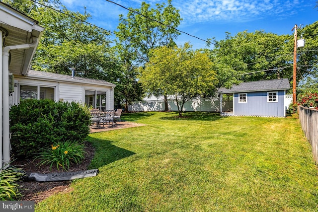 4212 Penner Ln, Fairfax, VA 22033 - view of yard featuring an outdoor structure and a patio area
