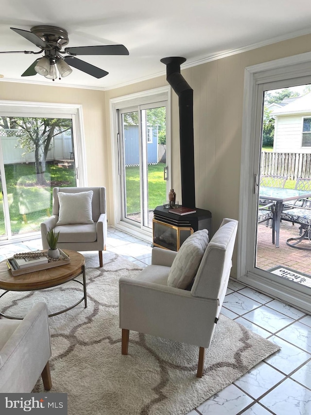 4212 Penner Ln, Fairfax, VA 22033 - living room with a wood stove, crown molding, ceiling fan, and marble finish flooring