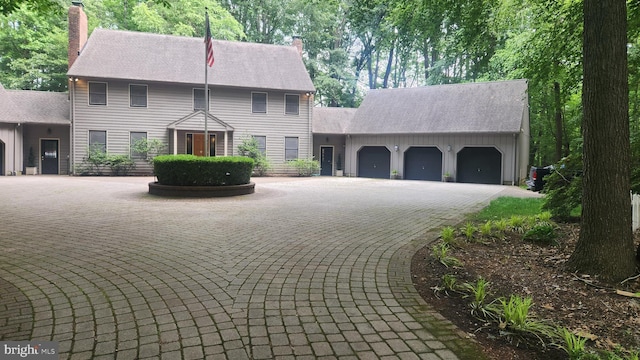 2317 Nancarles Dr, Gambrills, MD 21054 - colonial home with a chimney, an attached garage, and driveway