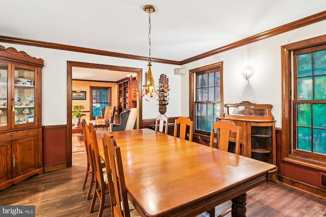2317 Nancarles Dr, Gambrills, MD 21054 - dining area featuring a chandelier, dark wood finished floors, crown molding, and wainscoting
