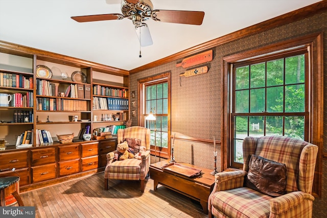 2317 Nancarles Dr, Gambrills, MD 21054 - sitting room with wallpapered walls, hardwood / wood-style flooring, crown molding, and ceiling fan
