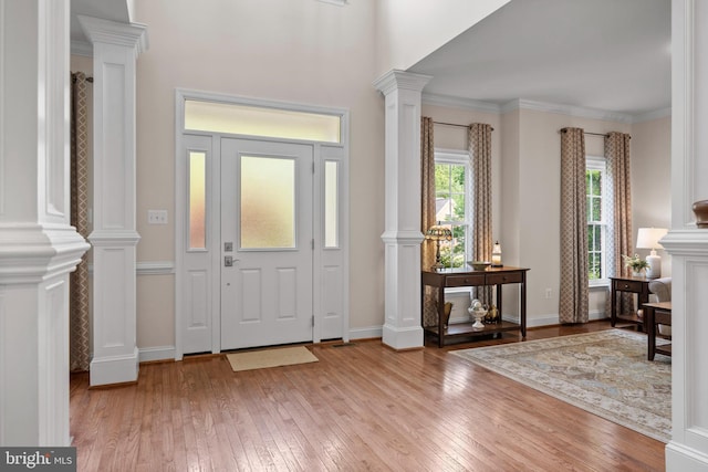 6000 Clairemont Dr, Owings, MD 20736 - foyer entrance with hardwood / wood-style flooring, decorative columns, and baseboards