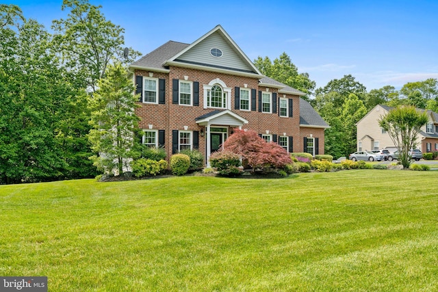 6000 Clairemont Dr, Owings, MD 20736 - colonial home with brick siding and a front yard