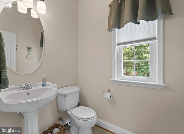 6000 Clairemont Dr, Owings, MD 20736 - bathroom featuring toilet, baseboards, a chandelier, and tile patterned flooring