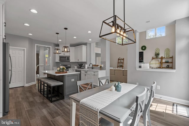 6000 Clairemont Dr, Owings, MD 20736 - dining space with recessed lighting, baseboards, dark wood-style flooring, and a chandelier