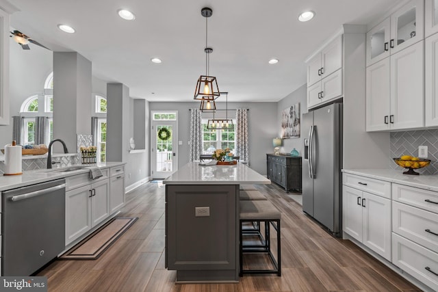 6000 Clairemont Dr, Owings, MD 20736 - kitchen featuring appliances with stainless steel finishes, white cabinets, a sink, and recessed lighting