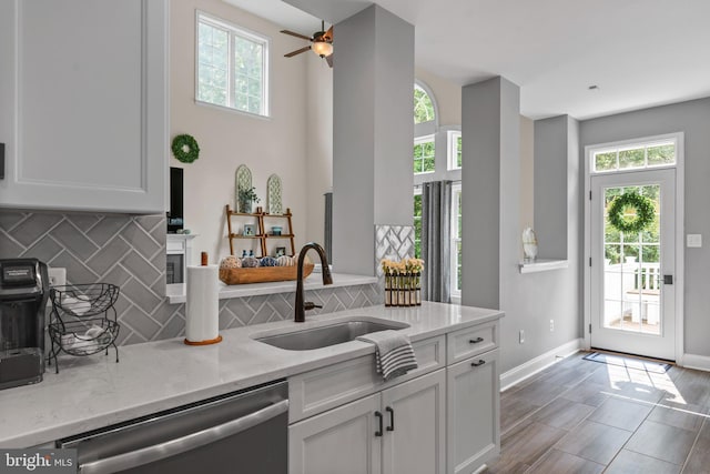 6000 Clairemont Dr, Owings, MD 20736 - kitchen with a sink, stainless steel dishwasher, healthy amount of natural light, and decorative backsplash