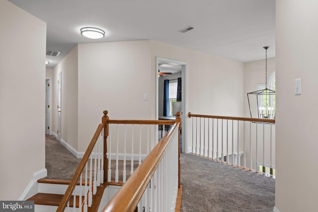 6000 Clairemont Dr, Owings, MD 20736 - corridor with carpet floors, an upstairs landing, and baseboards