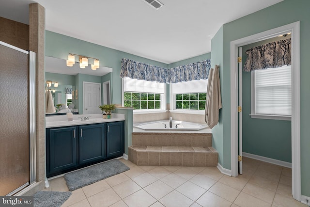 6000 Clairemont Dr, Owings, MD 20736 - full bathroom featuring vanity, a bath, tile patterned floors, a stall shower, and baseboards