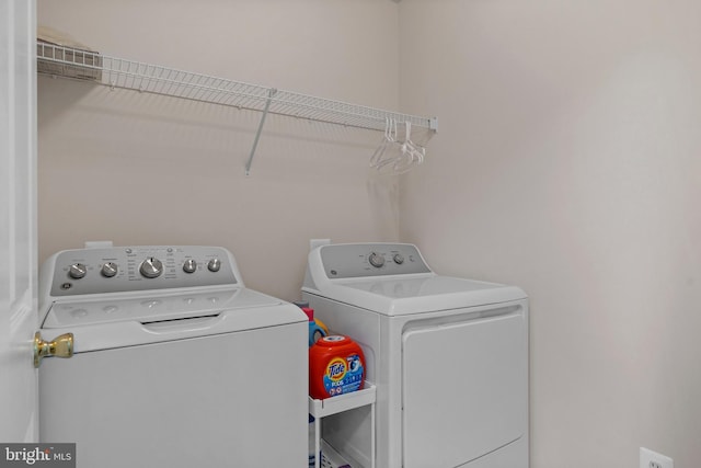 6000 Clairemont Dr, Owings, MD 20736 - laundry room featuring separate washer and dryer