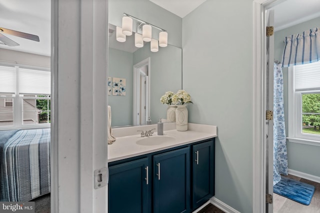 6000 Clairemont Dr, Owings, MD 20736 - bathroom with vanity, ceiling fan, and baseboards