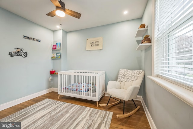 330 Date St, Warminster, PA 18974 - bedroom with a crib, wood finished floors, baseboards, ceiling fan, and recessed lighting